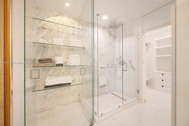 480 NE 31st St Unit 3802, Miami, FL 33137 - full bath with a shower stall, tile patterned floors, and a closet