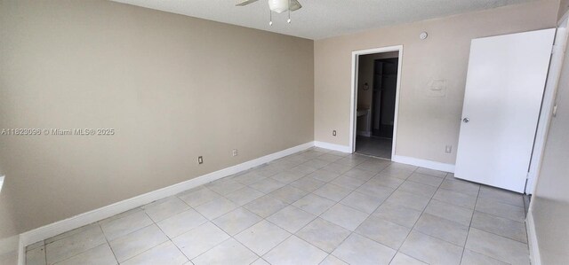 14830 Naranja Lakes Blvd Unit A1B, Homestead, FL 33032 - unfurnished bedroom featuring light tile patterned floors, a textured ceiling, and ceiling fan