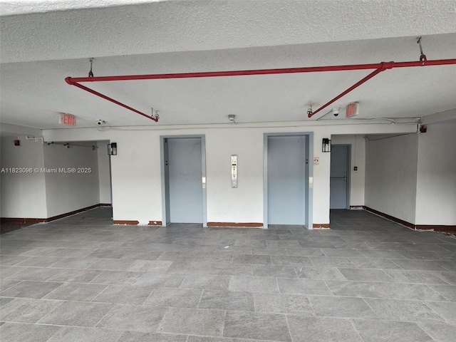14830 Naranja Lakes Blvd Unit A1B, Homestead, FL 33032 - garage with elevator and baseboards
