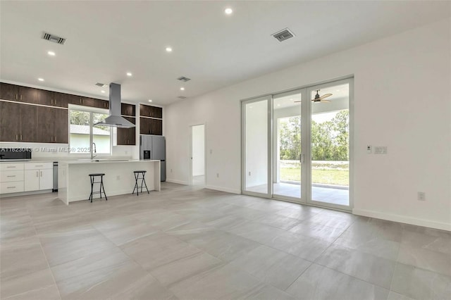 337 Jourferie Rd, Lehigh Acres, FL 33974 - unfurnished living room featuring recessed lighting and light tile patterned flooring