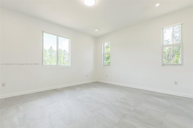 337 Jourferie Rd, Lehigh Acres, FL 33974 - spare room with recessed lighting and light tile patterned floors