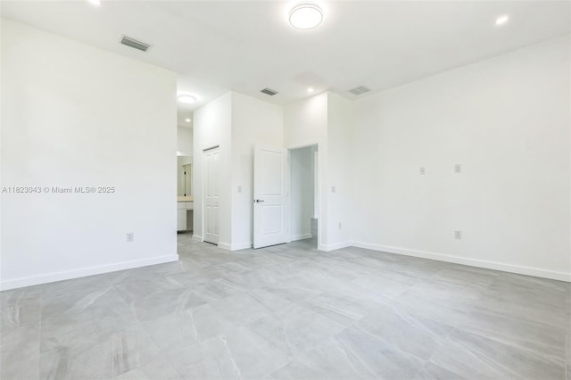 337 Jourferie Rd, Lehigh Acres, FL 33974 - spare room with baseboards and recessed lighting