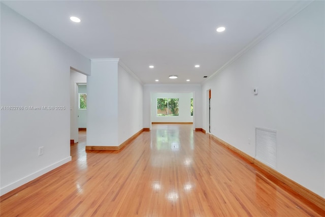 708 Navarre Ave, Coral Gables, FL 33134 - spare room with ornamental molding, light wood-style flooring, and recessed lighting