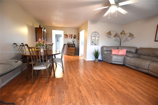 118 Brighton C 118, Boca Raton, FL 33434 - dining area featuring a textured ceiling, light wood finished floors, and a ceiling fan