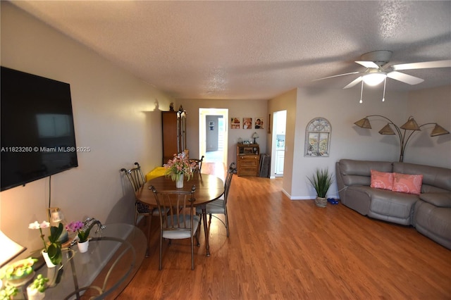 118 Brighton C 118, Boca Raton, FL 33434 - dining area with wood finished floors, a textured ceiling, and a ceiling fan