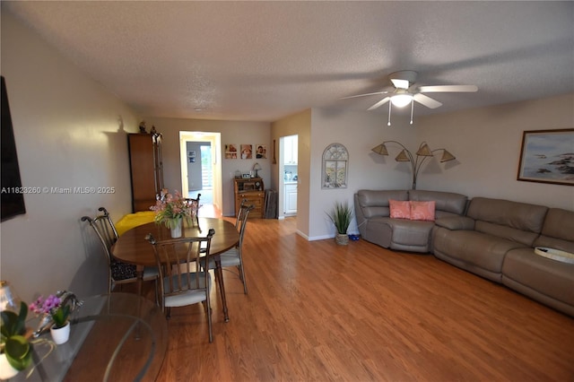 118 Brighton C 118, Boca Raton, FL 33434 - dining area with a textured ceiling, light wood-style flooring, and a ceiling fan