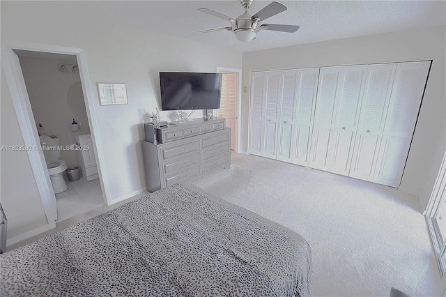 118 Brighton C 118, Boca Raton, FL 33434 - bedroom with ceiling fan, ensuite bathroom, a closet, and light colored carpet