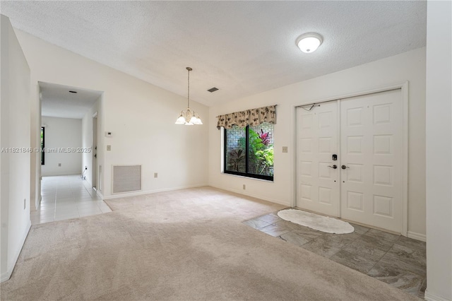 851 Altavista Ter, Davie, FL 33325 - entrance foyer featuring lofted ceiling, a chandelier, carpet flooring, and a textured ceiling