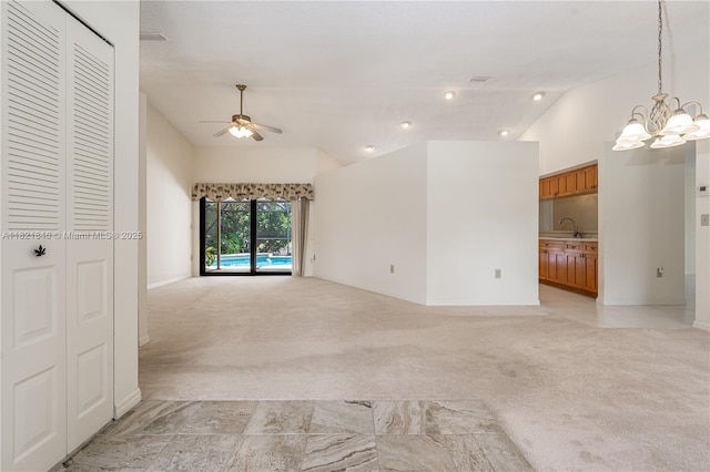 851 Altavista Ter, Davie, FL 33325 - unfurnished living room with vaulted ceiling, ceiling fan, light colored carpet, a chandelier, and recessed lighting