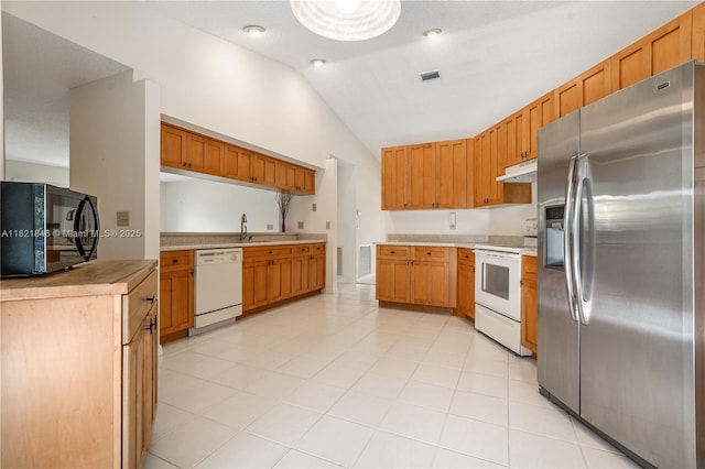 851 Altavista Ter, Davie, FL 33325 - kitchen with white appliances, under cabinet range hood, lofted ceiling, light countertops, and brown cabinetry
