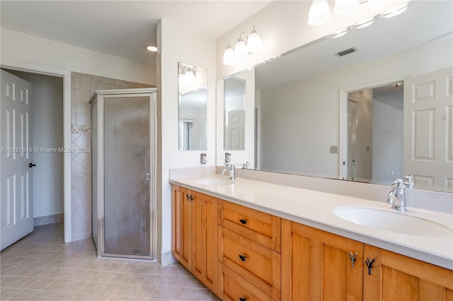851 Altavista Ter, Davie, FL 33325 - bathroom featuring double vanity, a stall shower, and tile patterned floors