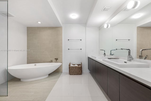 300 Sunny Isles Blvd Unit 4-2303, Sunny Isles Beach, FL 33160 - full bathroom with double vanity, a freestanding tub, and tile patterned floors
