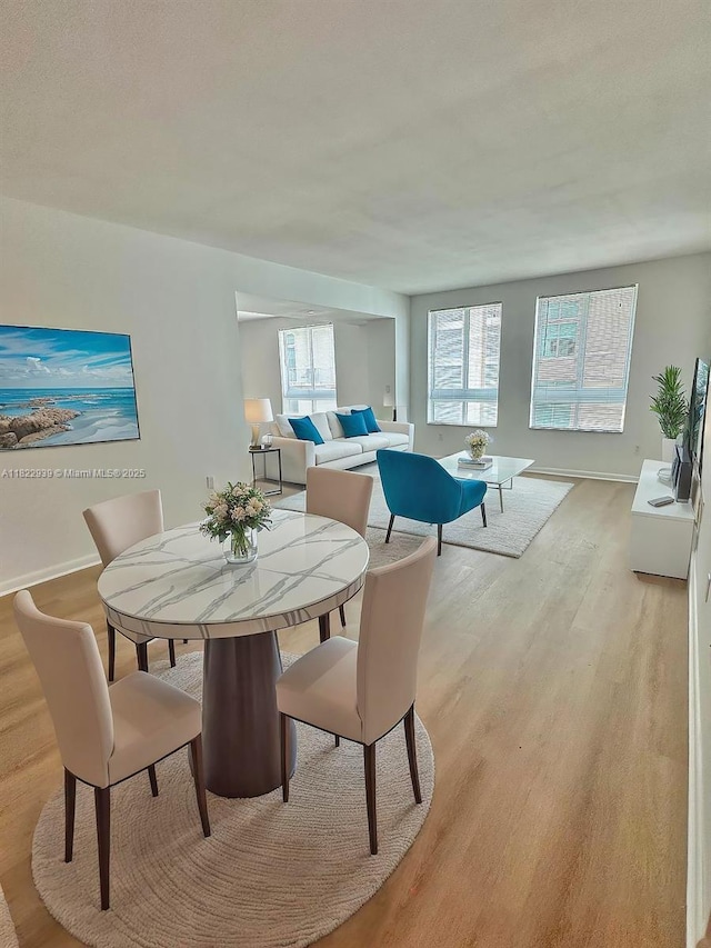 7350 SW 89th St Unit 602S, Miami, FL 33156 - dining room featuring light wood-type flooring and baseboards