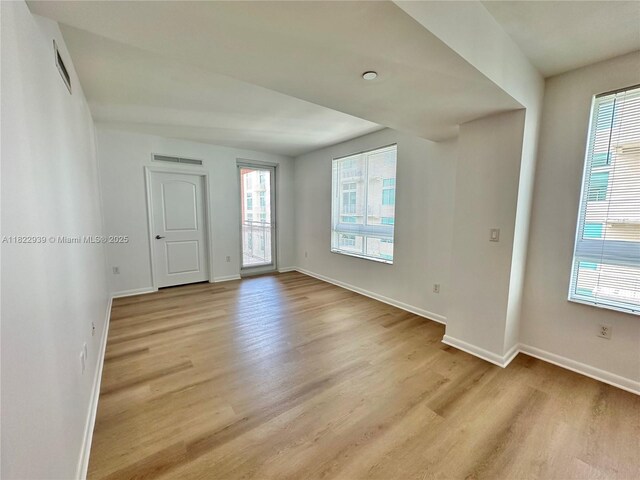 7350 SW 89th St Unit 602S, Miami, FL 33156 - empty room featuring light wood-style floors