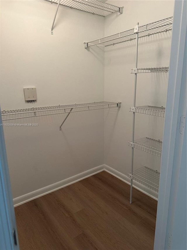 7350 SW 89th St Unit 602S, Miami, FL 33156 - walk in closet featuring wood finished floors