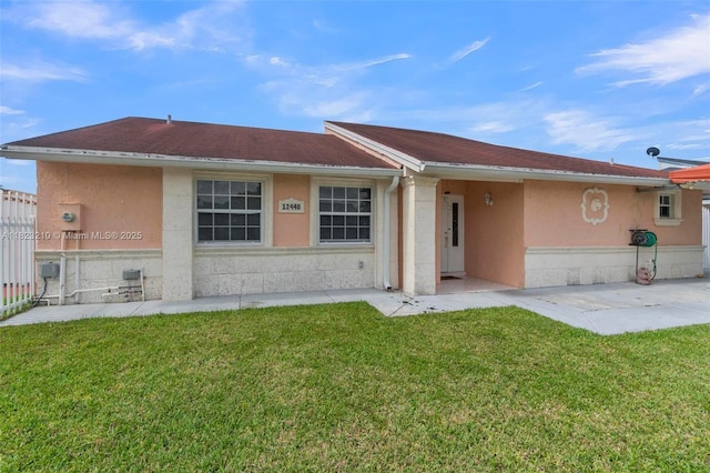 12440 SW 207th Ter, Miami, FL 33177 - view of front of house featuring stucco siding and a front yard