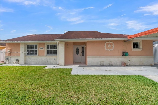 12440 SW 207th Ter, Miami, FL 33177 - view of front of house with a front lawn and stucco siding