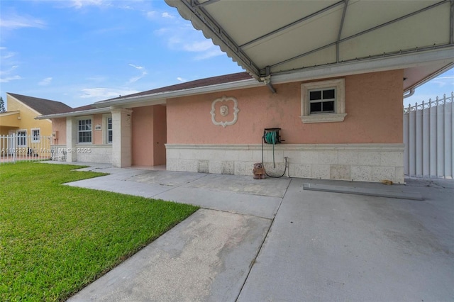 12440 SW 207th Ter, Miami, FL 33177 - view of home's exterior with stucco siding and a patio area