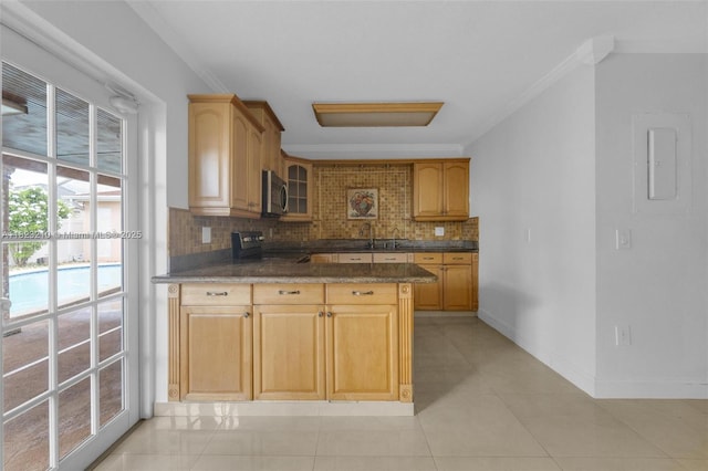 12440 SW 207th Ter, Miami, FL 33177 - kitchen featuring stainless steel microwave, electric stove, crown molding, backsplash, and glass insert cabinets