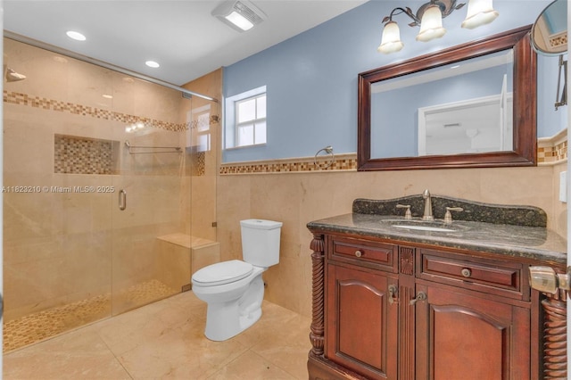 12440 SW 207th Ter, Miami, FL 33177 - full bath featuring vanity, a shower stall, tile walls, tile patterned floors, and wainscoting