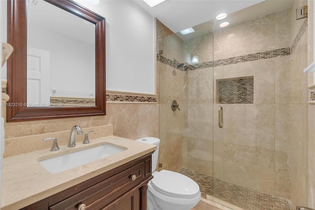 12440 SW 207th Ter, Miami, FL 33177 - bathroom with a stall shower, vanity, and tile walls
