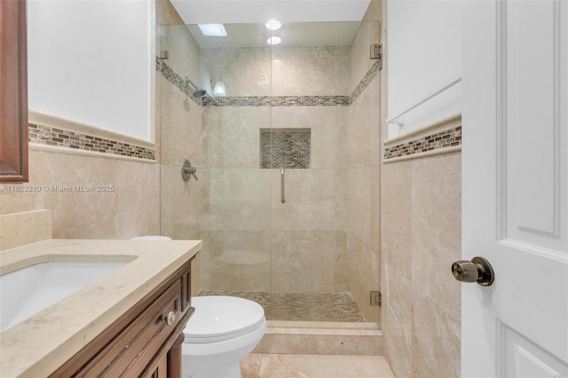 12440 SW 207th Ter, Miami, FL 33177 - bathroom with tile walls, vanity, and a shower stall