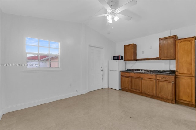 12440 SW 207th Ter, Miami, FL 33177 - kitchen featuring freestanding refrigerator, brown cabinets, lofted ceiling, a ceiling fan, and black microwave