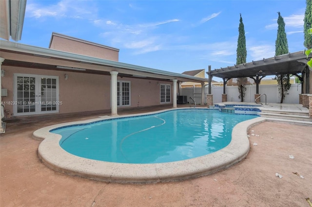 12440 SW 207th Ter, Miami, FL 33177 - view of swimming pool with french doors, a patio, a fenced backyard, and a pool with connected hot tub