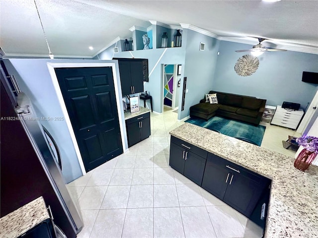 2433 NW 92nd Ave, Coral Springs, FL 33065 - kitchen featuring ornamental molding, lofted ceiling, a ceiling fan, dark cabinets, and light stone countertops