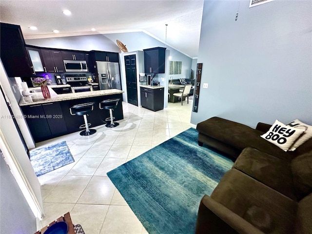 2433 NW 92nd Ave, Coral Springs, FL 33065 - living area featuring vaulted ceiling, light tile patterned flooring, and recessed lighting