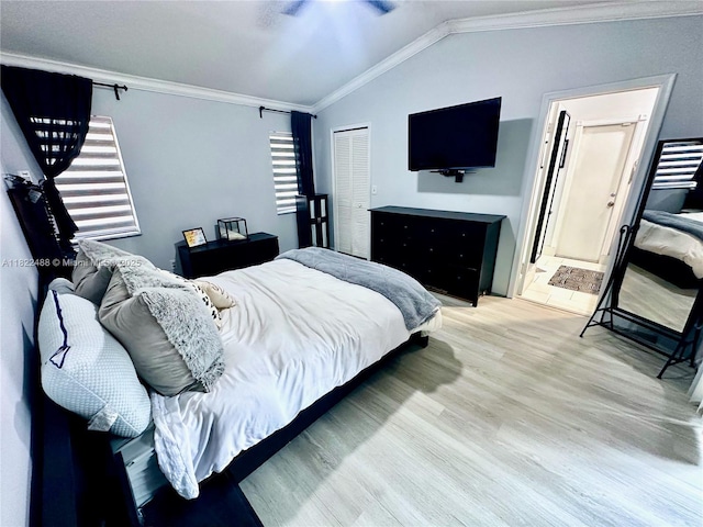 2433 NW 92nd Ave, Coral Springs, FL 33065 - bedroom with crown molding, light wood finished floors, vaulted ceiling, a closet, and ensuite bath