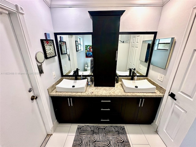 2433 NW 92nd Ave, Coral Springs, FL 33065 - bathroom featuring double vanity, tile patterned floors, and ornamental molding