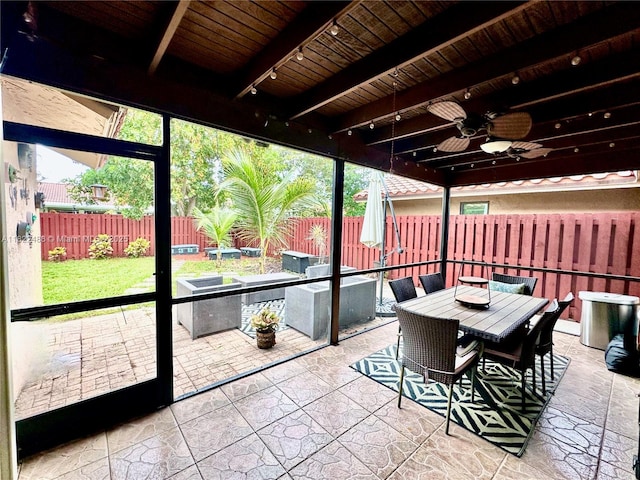 2433 NW 92nd Ave, Coral Springs, FL 33065 - sunroom featuring track lighting, a ceiling fan, and outdoor dining space