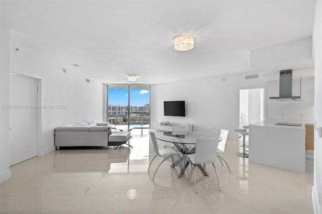 17301 Biscayne Blvd Unit 1704, North Miami Beach, FL 33160 - dining space featuring floor to ceiling windows and light tile patterned floors