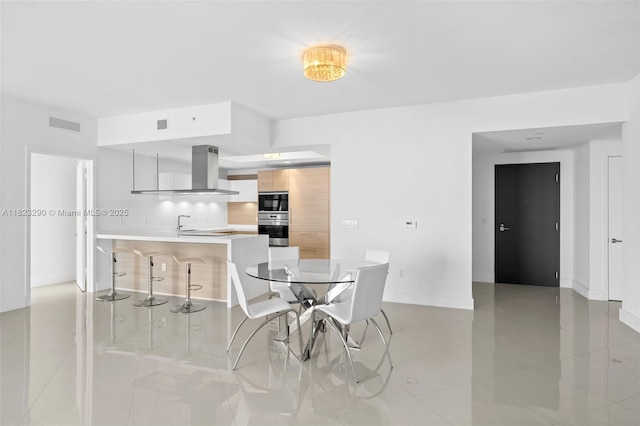 17301 Biscayne Blvd Unit 1704, North Miami Beach, FL 33160 - dining room with baseboards and light tile patterned flooring