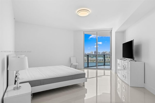 17301 Biscayne Blvd Unit 1704, North Miami Beach, FL 33160 - bedroom with expansive windows and light tile patterned floors
