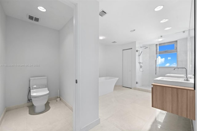 17301 Biscayne Blvd Unit 1704, North Miami Beach, FL 33160 - full bathroom featuring vanity, a freestanding tub, a shower stall, tile patterned flooring, and recessed lighting