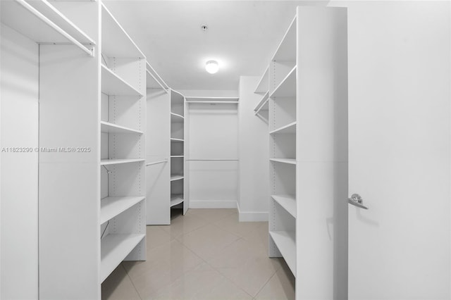 17301 Biscayne Blvd Unit 1704, North Miami Beach, FL 33160 - walk in closet featuring tile patterned flooring