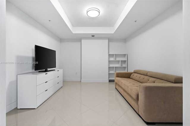 17301 Biscayne Blvd Unit 1704, North Miami Beach, FL 33160 - living area with a tray ceiling and baseboards