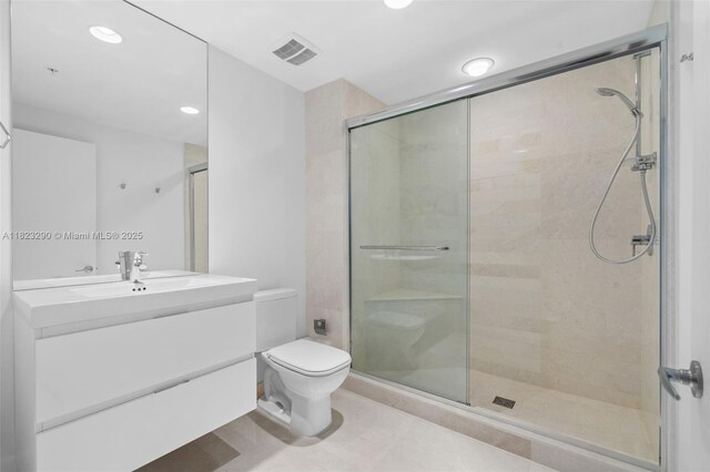 17301 Biscayne Blvd Unit 1704, North Miami Beach, FL 33160 - bathroom featuring a stall shower, vanity, and recessed lighting