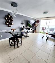 2910 Point E Dr Unit M610, Aventura, FL 33160 - tiled dining room with baseboards
