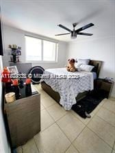 2910 Point E Dr Unit M610, Aventura, FL 33160 - bedroom featuring light tile patterned floors and a ceiling fan