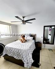 2910 Point E Dr Unit M610, Aventura, FL 33160 - bedroom featuring tile patterned flooring and ceiling fan