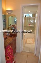 2910 Point E Dr Unit M610, Aventura, FL 33160 - corridor featuring tile patterned flooring