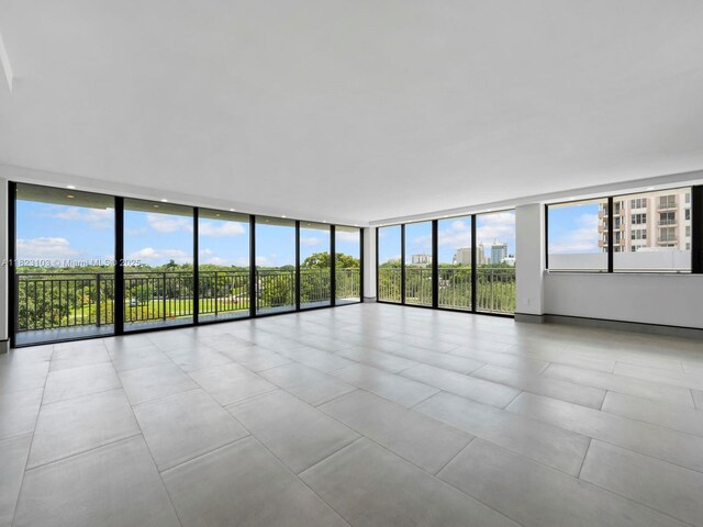 700 Coral Way Unit 5, Coral Gables, FL 33134 - empty room with floor to ceiling windows