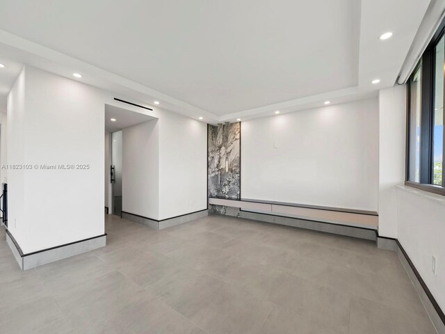 700 Coral Way Unit 5, Coral Gables, FL 33134 - unfurnished room featuring recessed lighting, a baseboard radiator, and concrete flooring