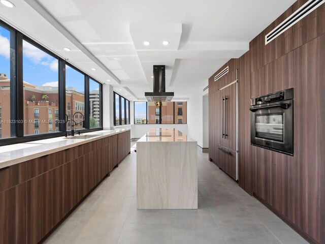 700 Coral Way Unit 5, Coral Gables, FL 33134 - kitchen with stainless steel oven, modern cabinets, exhaust hood, a center island, and recessed lighting