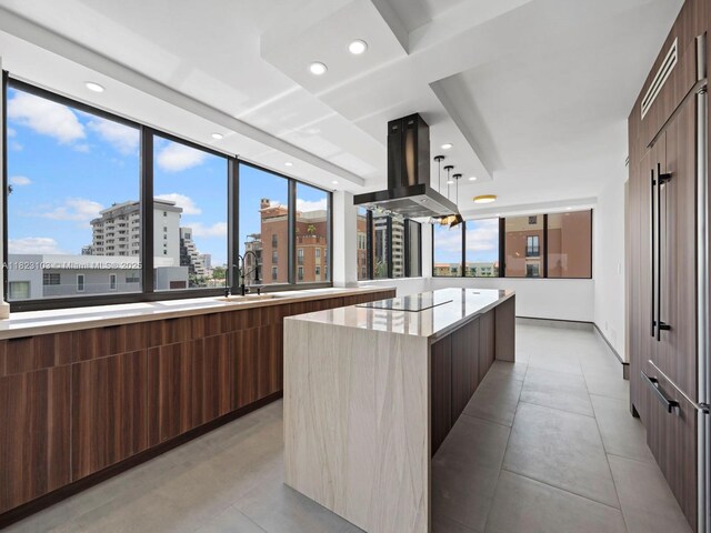 700 Coral Way Unit 5, Coral Gables, FL 33134 - kitchen featuring modern cabinets, island range hood, a center island, black electric cooktop, and a city view