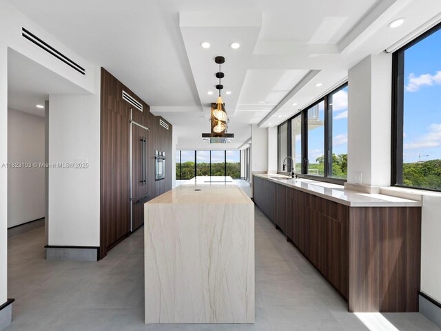 700 Coral Way Unit 5, Coral Gables, FL 33134 - kitchen featuring modern cabinets, light countertops, a center island, plenty of natural light, and recessed lighting
