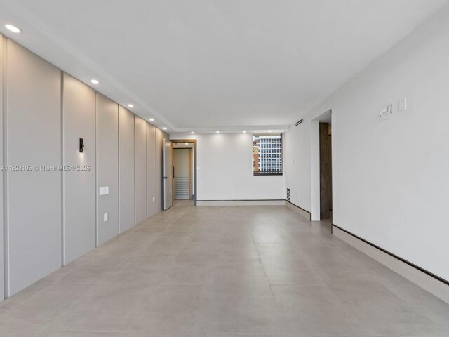 700 Coral Way Unit 5, Coral Gables, FL 33134 - empty room featuring recessed lighting and finished concrete flooring